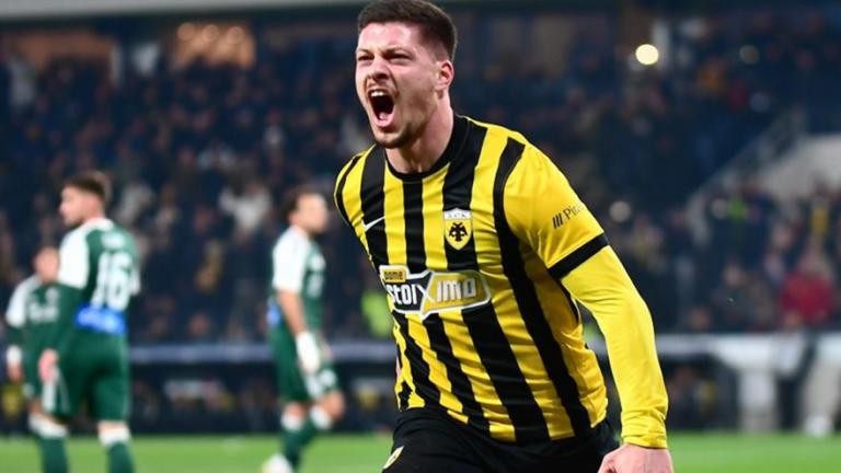 Ο Λούκα Γιόβιτς με τέσσερα γκολ έγραψε ιστορία με μια συγκλονιστική εμφάνιση και η ΑΕΚ βγήκε νικήτρια με 4-0 στο ντέρμπι κόντρα στον Παναθηναϊκό!  Σε ένα παιχνίδι που θα μνημονεύεται για το απίθανο σόου του Σέρβου επιθετικού (έφτασε τα επτά γκολ κόντρα στο «τριφύλλι» μετά το χατ-τρικ στη Λεωφόρο), η Ένωση τιμώρησε τους «πράσινους», που πληρώνουν τα λάθη και την κακή τους ανασταλτική λειτουργία. Εξαιρετική εμφάνιση από τους Λάζαρο Ρότα και Αρόλντ Μουκουντί, ενώ και ο Ορμπελίν Πινέδα ξεχώρισε με την παρουσία 